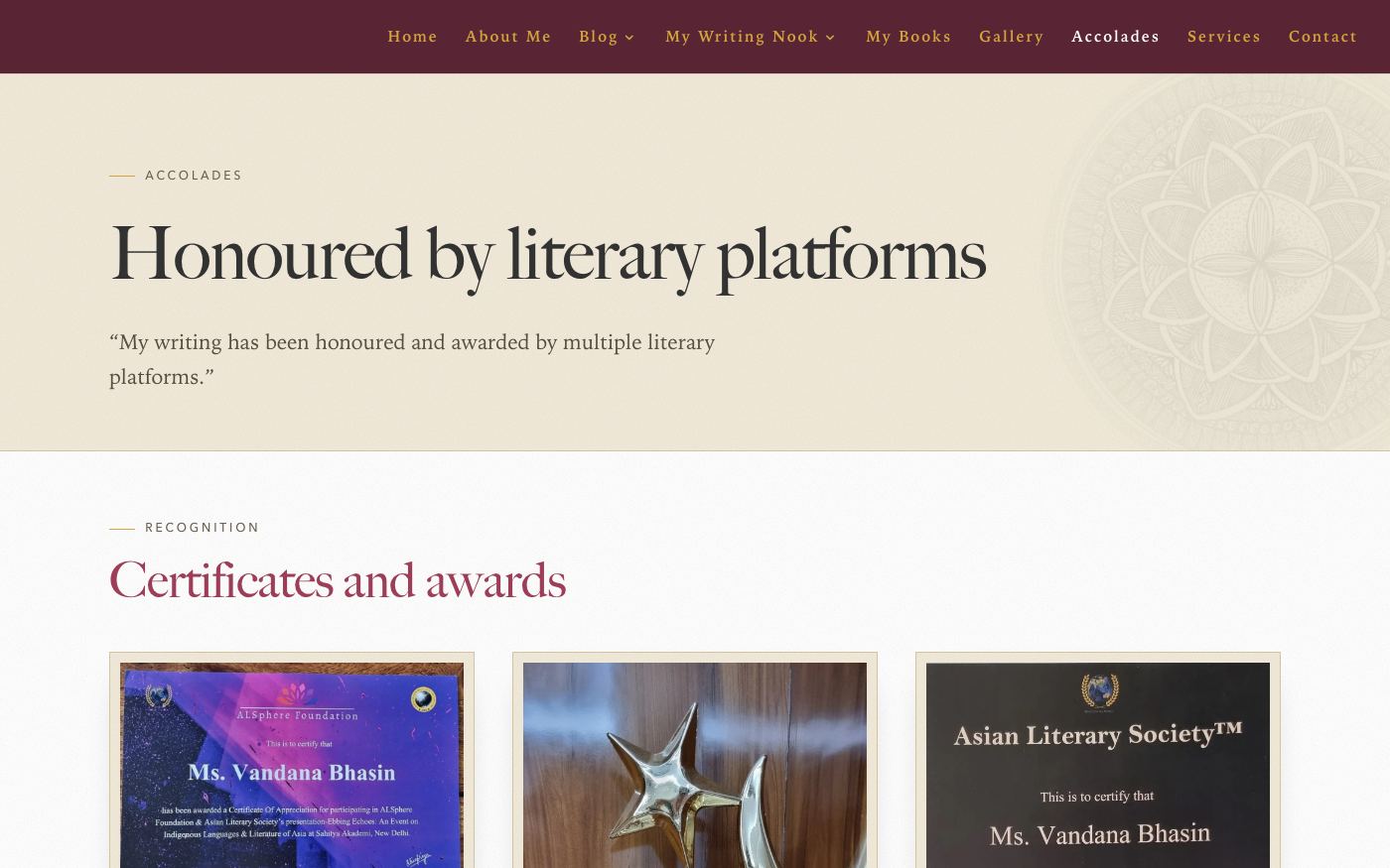 The new Accolades page with the heading Honoured by literary platforms and a grid of certificates and awards